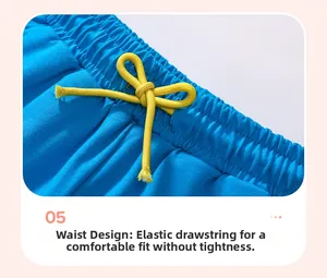 Détail de la taille élastique du short en coton bleu pour garçon avec cordon jaune