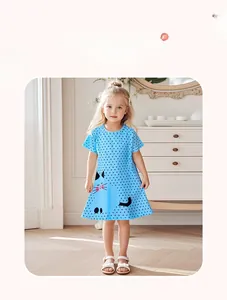 Girl's short sleeve light blue cotton dress with black polka dots and cat pattern detail