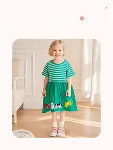 Detail of short sleeve girls dress featuring green stripes and cute animal print hem