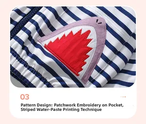 Detail of shark applique and striped cotton fabric on children's hooded sweatshirt