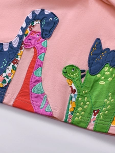 Pink girl's cotton dress with colorful dinosaur applique and floral embroidery