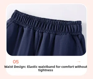 Detail of navy cotton boy pants featuring a stretchy elastic waistband for comfort