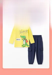 Detail of boys yellow superhero crocodile sweatshirt and navy cargo pants outfit set