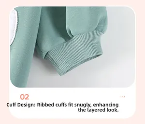 Detail view of mint green ribbed cuffs on cotton jersey kids' sweatshirt sleeve