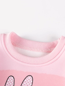 Pink girl's long-sleeve sweatshirt featuring round neck and checkered pattern details