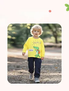 Detail of yellow cotton long-sleeve tee with superhero crocodile print and navy cargo pants
