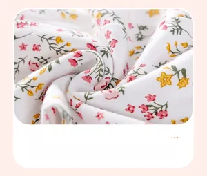 Detail of soft cotton baby fabric with colorful floral prints and watermark technique