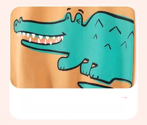 Detail of cartoon crocodile print on orange cotton shirt using offset printing technique