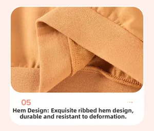 Detail view of the ribbed hem on a mustard yellow knitted boys' sweatshirt