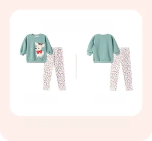 Front and back view of girls green long sleeve pajama set with deer print and floral pants