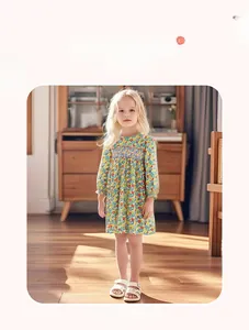 Detail view of long-sleeve floral cotton dress with smocking neck and vibrant prints