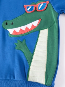 Blue knit toddler sweatshirt featuring a green cartoon crocodile embroidery with red sunglasses