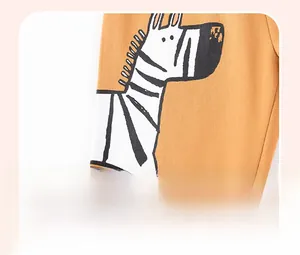 Detail of zebra cartoon print on ginger yellow knit fabric with offset printing process