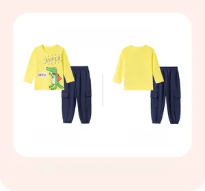 Detail of yellow cotton long-sleeve T-shirt with superhero crocodile and navy blue joggers