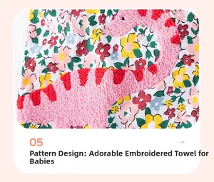 Détail de broderie dinosaure rose sur une robe en coton fleurie pour filles