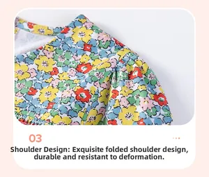 Detailed view of colorful floral cotton dress featuring hand-smocked shoulder craftsmanship