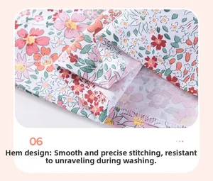 Macro shot of cotton girls dress hem with pink floral pattern and precise stitching