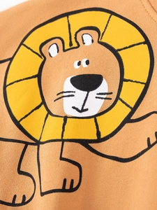Caramel brown knitted toddler outfit with a cute minimalist cartoon lion print
