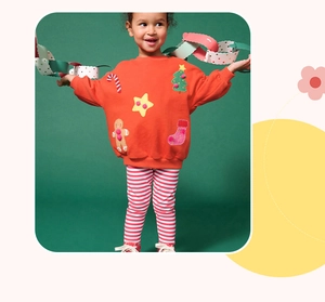 Details von Mädchen Weihnachtsoutfit mit Lebkuchenmann-Stickerei und Streifen-Leggings