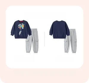 Flat lay of boys' cotton tracksuit set featuring astronaut print and cargo pants