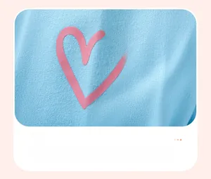 Close-up of pink heart 3D print on light blue striped cotton sleeve for girl outfits