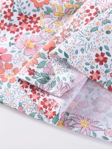 Floral print cotton dress for girls featuring multicolor blossoms and reinforced hem stitch