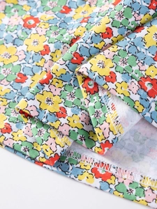 Kids colorful floral print cotton dress featuring detailed overlock stitching finish