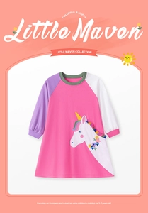 Detail of pink cotton girls dress featuring unicorn embroidery and rainbow fringe