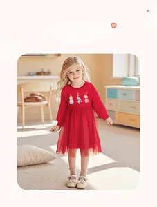 Detail of red Christmas dress for girls featuring holiday embroidery and tulle skirt
