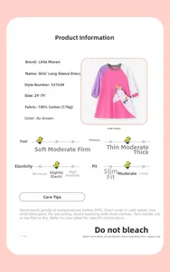 Detail of pink cotton long-sleeve dress featuring unicorn prints and color-block design