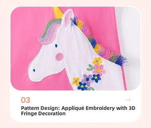 Close-up of unicorn embroidery with 3D colorful tassels on pink cotton girls dress