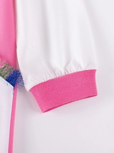 Long sleeve cotton girl's dress with pink ribbed cuffs and colorful fringe detail