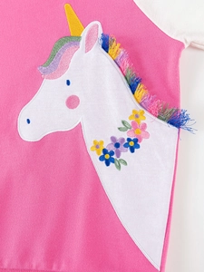 Pink cotton knit toddler top with unicorn embroidery and colorful fringe details