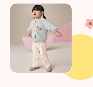 Close-up of grey girls' cardigan with 3D bear applique and fun team embroidery detail