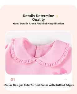 Close-up of pink knit top featuring a double-layered ruffle collar with pleated lace trim