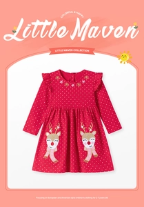 Detail of red polka dot girl dress with snowflake embroidery and reindeer appliqué