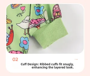 Detail of ribbed cuffs on a light green sweatshirt with colorful cartoon animal patterns