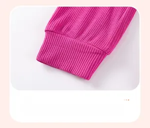 Detail view of pink ribbed knit cuff with durable stitching and vertical texture