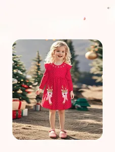 Detail of red Christmas long sleeve girl dress with reindeer patches and white polka dots
