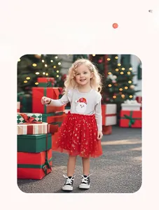 Detailed view of Christmas girls outfit with Santa top and red sequin tulle skirt