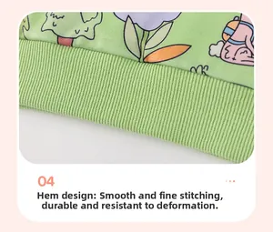 Detail view of ribbed hem on light green children hoodie with colorful cartoon patterns