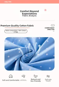 Detail of 100% cotton light blue polka dot fabric showing 170g soft knit texture