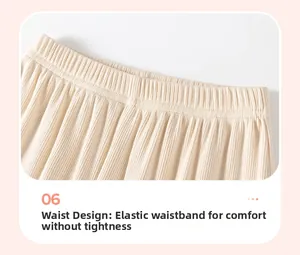Close-up of elastic waistband on beige ribbed leggings with soft stretch texture