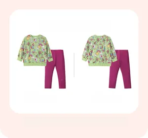 Flat lay of girl's long-sleeve green cartoon set and purple leggings showing front and back