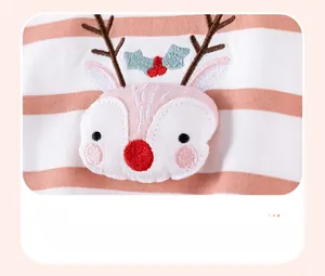 Detail of baby girl stripe outfit featuring a 3D plush reindeer applique with embroidery