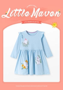 Detail of baby girl dress with white polka dots and cute bunny floral embroidery
