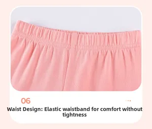 Detail of pink cotton girl's shorts featuring a flexible elastic waistband for comfort