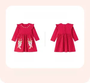 Flat lay detail of red Christmas dress for girls with reindeer embroidery and white dots