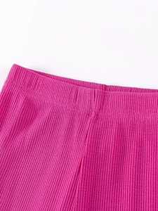 Girls rose pink ribbed knit leggings featuring high elastic waistband and vertical texture