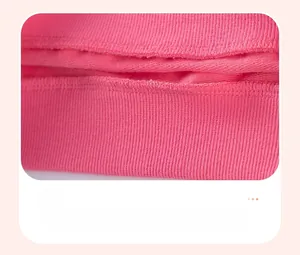 Close-up of pink girls' sweatshirt showing reinforced seam stitching and ribbed cuff detail